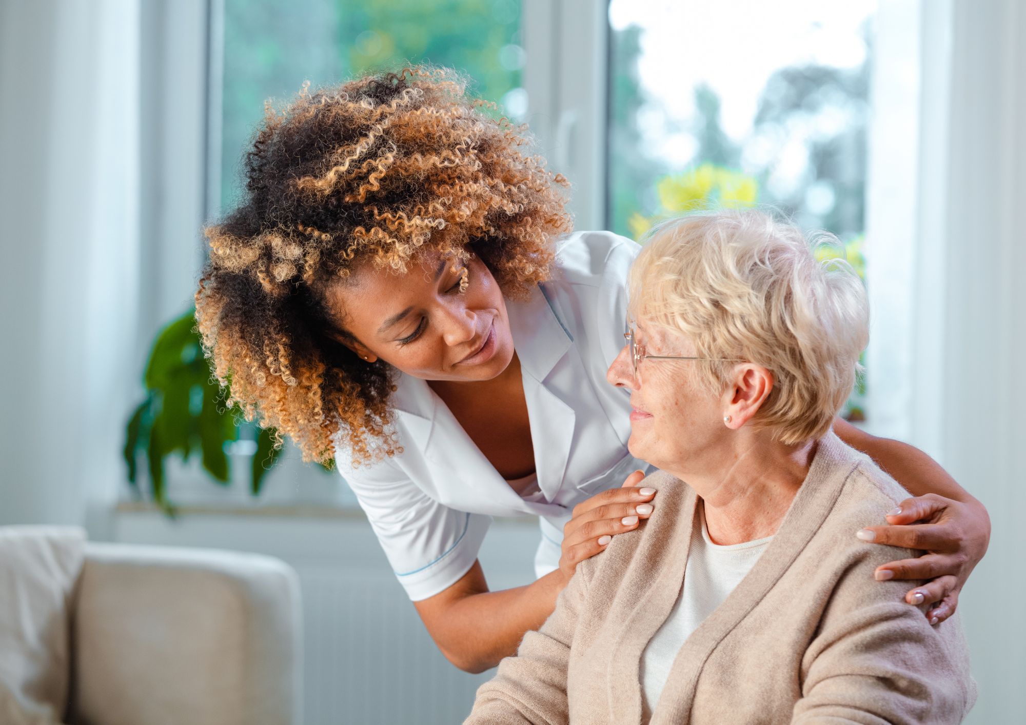 Female healthcare worker with elderly lady